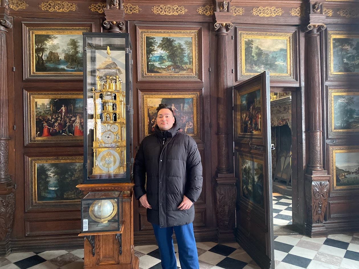 Areeb researching in a grand library